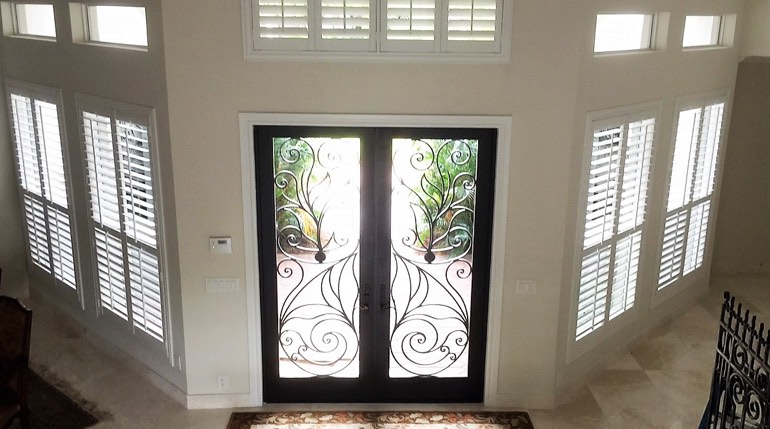 Tampa foyer with glass doors and plantation shutters